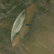 The very distinctive nine kilometre arc shape of the Maitengwe Dam earth wall, with the diversion from nearby Thekwane River at the top and the spillway at the bottom.